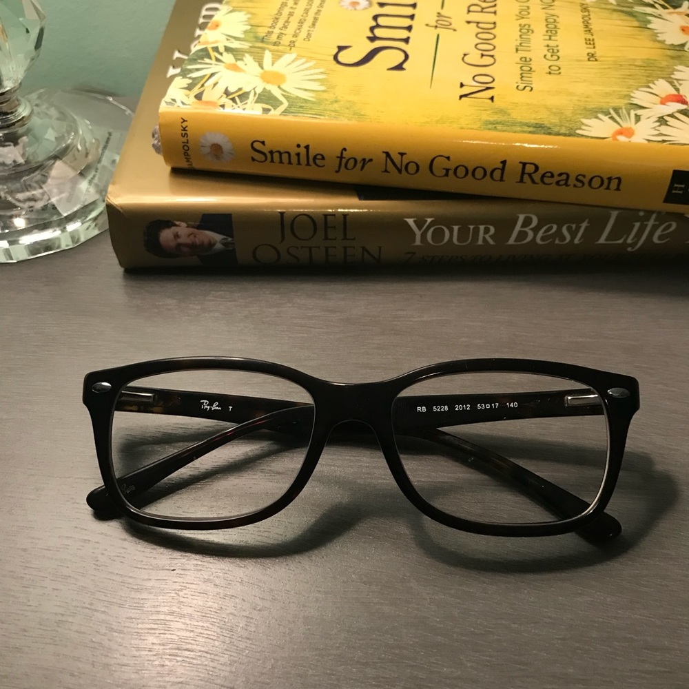 Ray Ban glasses.